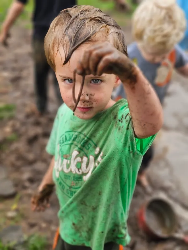 Muddy hands outdoor exploration