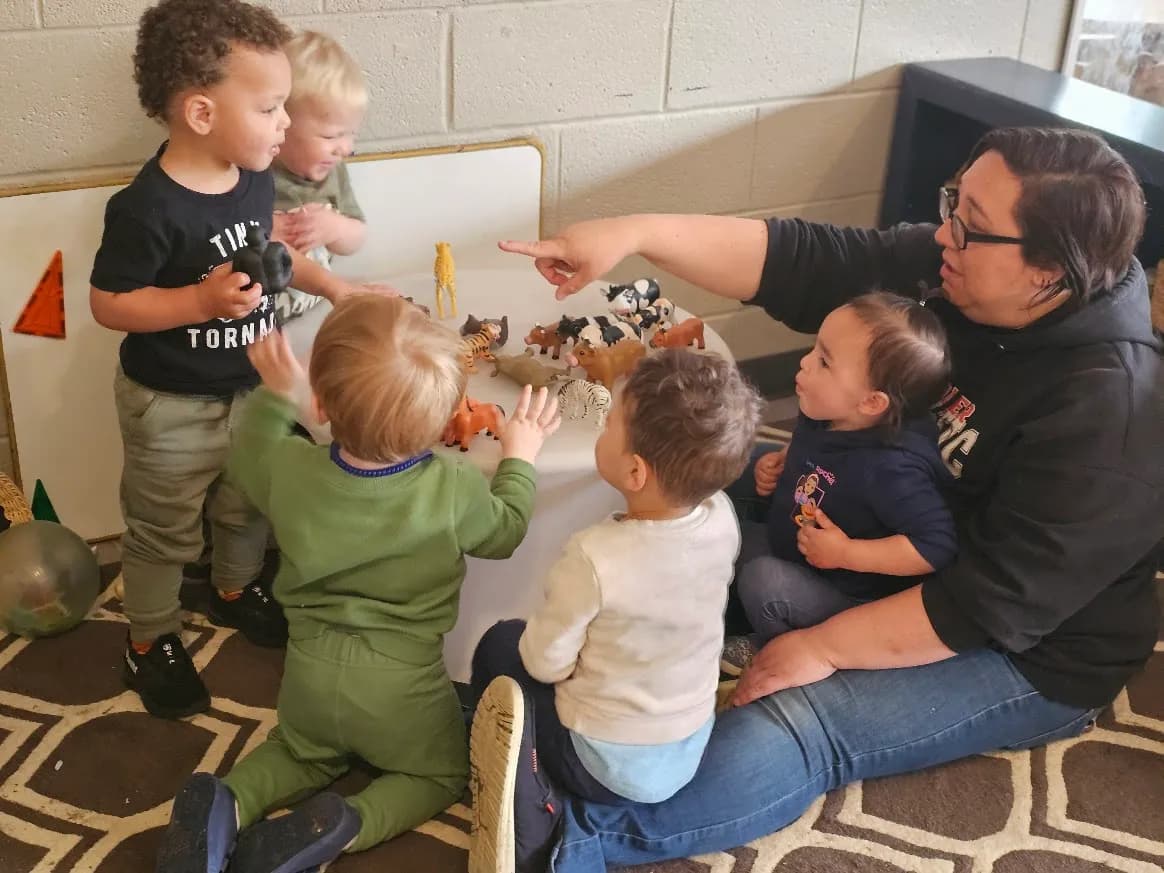 Toy animals with a teacher