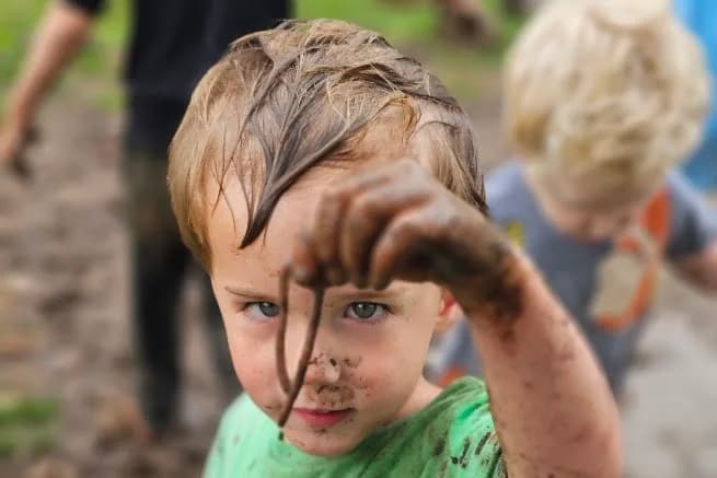 Children exploring outdoors at SquareOne Early Learning Center